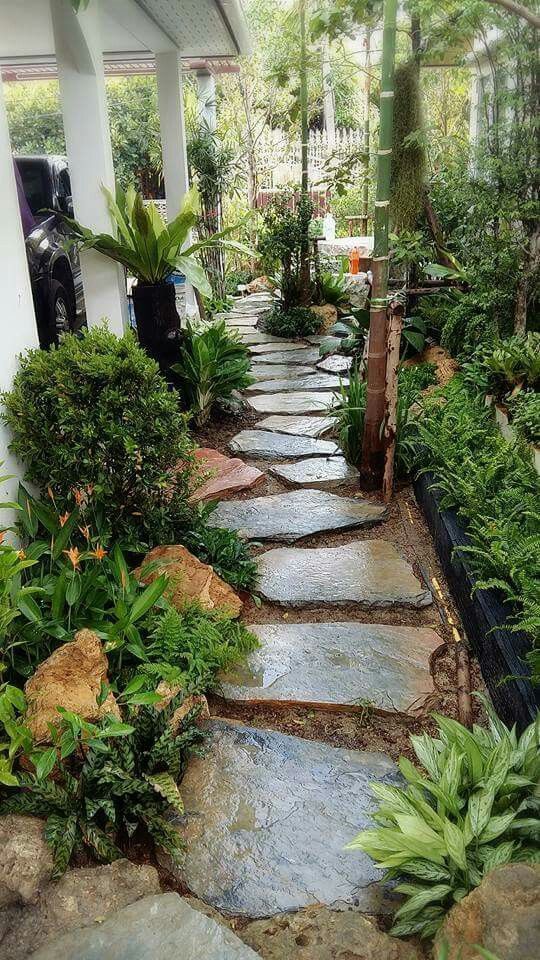 side of house landscaping ideas - give your house a rustic feel using stepping stones